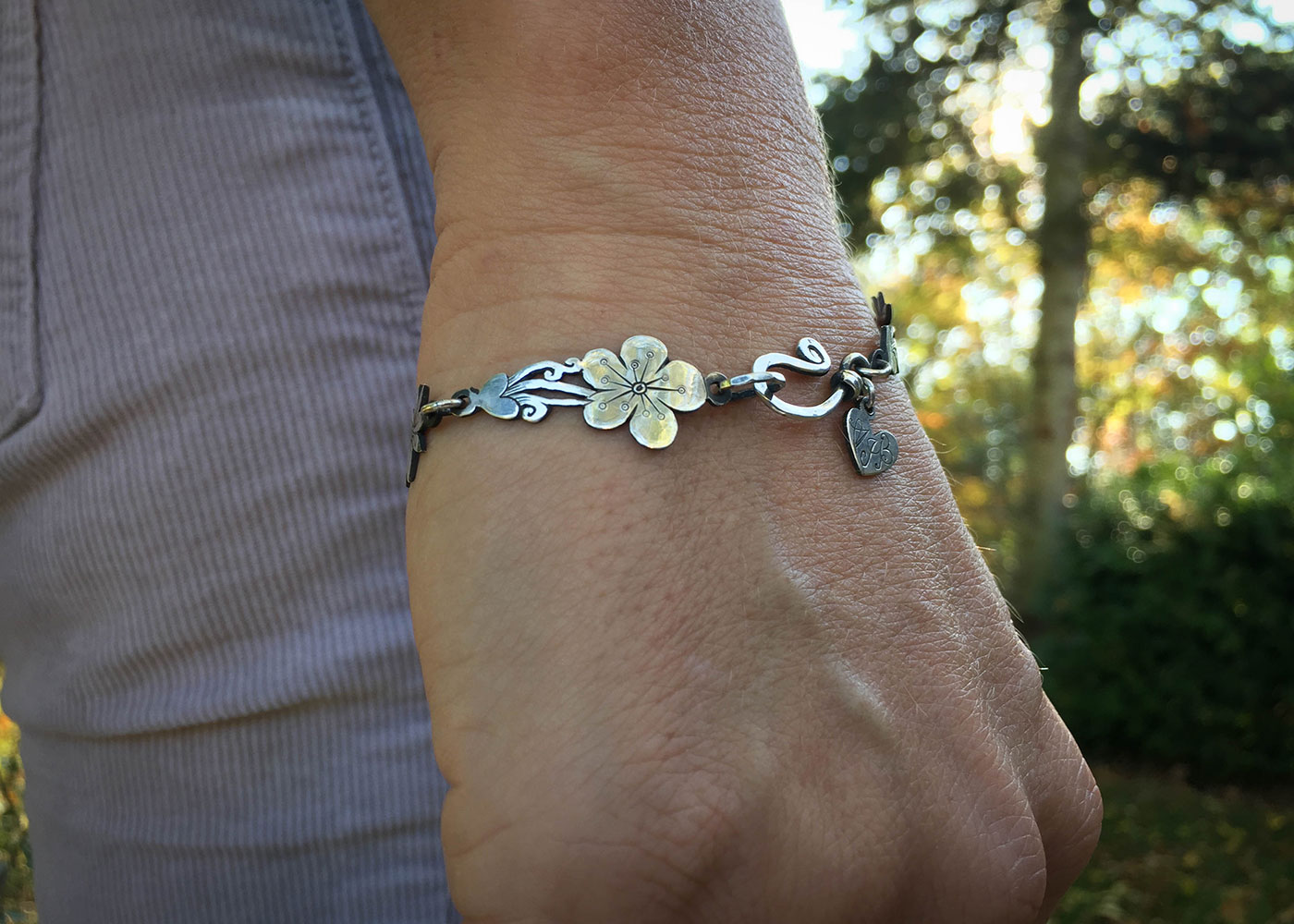 Wild flower bracelet made from recycled sterling silver coins