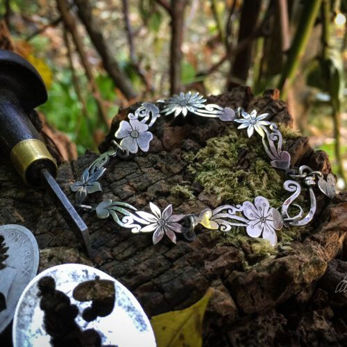 Wild flower bracelet made from recycled sterling silver coins