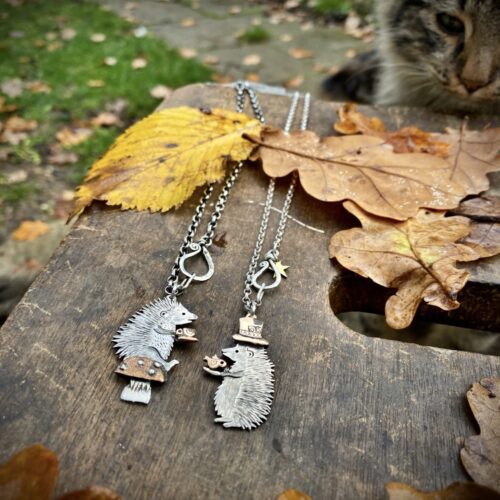 a hedgehog gathering, necklaces made from old silver coins