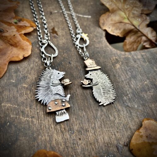 a hedgehog gathering, necklaces made from old silver coins