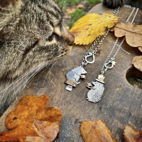 a hedgehog gathering, necklaces made from old silver coins