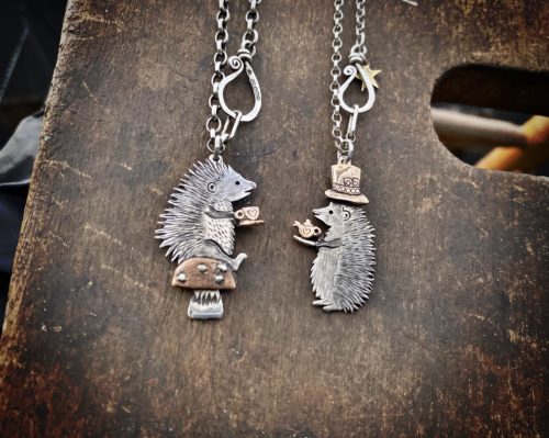 a hedgehog gathering, necklaces made from old silver coins