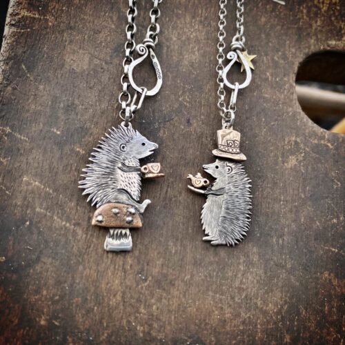 a hedgehog gathering, necklaces made from old silver coins