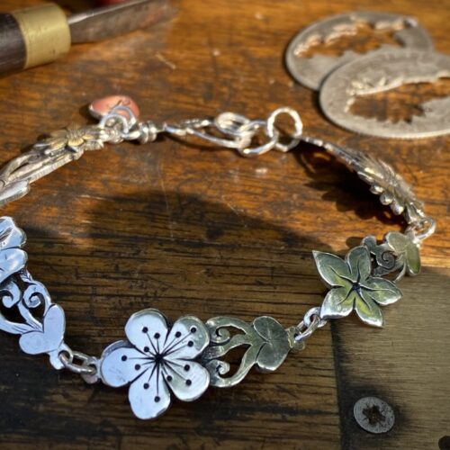 flower bracelet made from recycled sterling silver coins