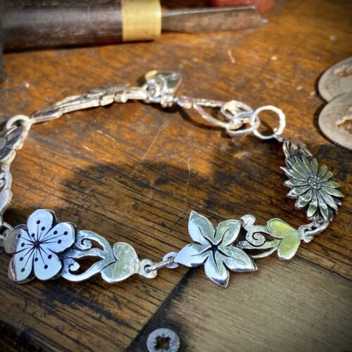 flower bracelet made from recycled sterling silver coins