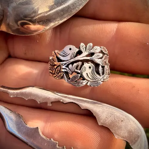 Lovebirds love birds ring made in Cambridge, England using recycled silver and traditional hand tools