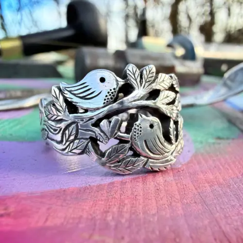 Lovebirds love birds ring made in Cambridge, England using recycled silver and traditional hand tools
