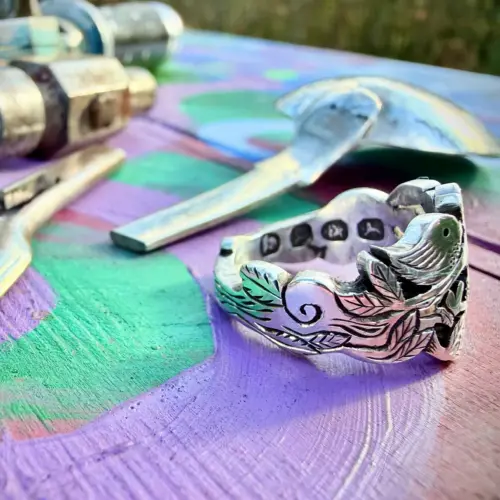 Lovebirds love birds ring made in Cambridge, England using recycled silver and traditional hand tools