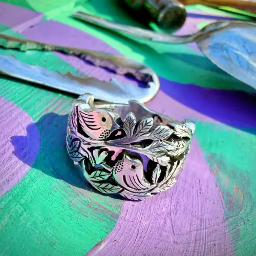 Lovebirds love birds ring made in Cambridge, England using recycled silver and traditional hand tools
