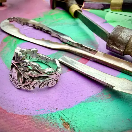 Lovebirds love birds ring made in Cambridge, England using recycled silver and traditional hand tools