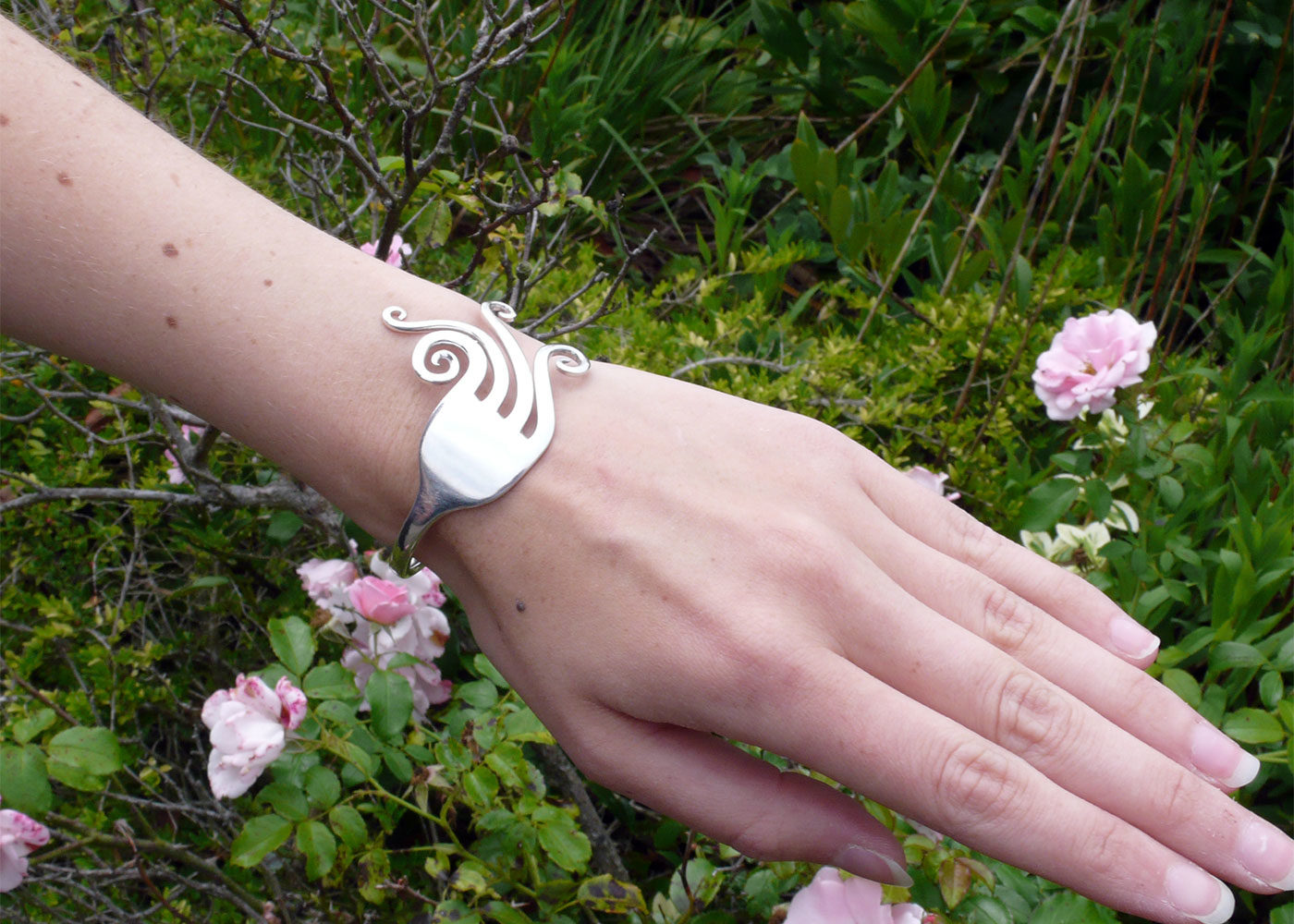 Handcrafted and recycled swirls fork bangle worn