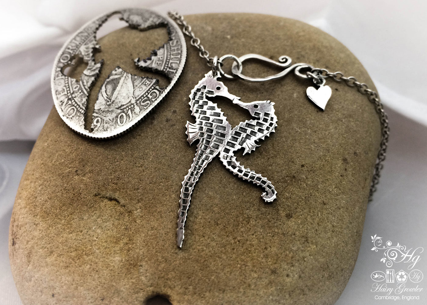seahorse jewellery hand made and upcycled silver coin seahorses in love necklace
