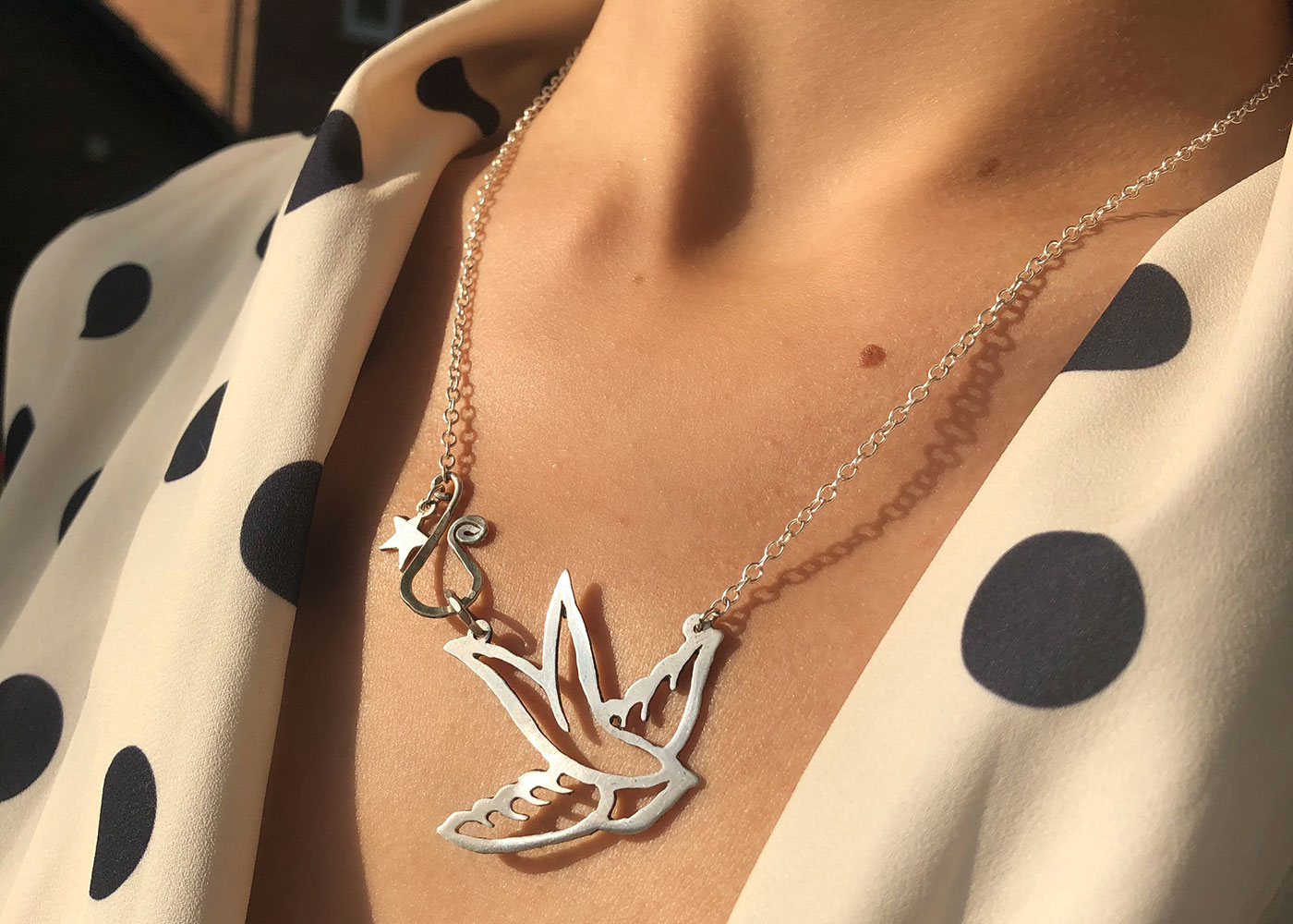 Swallow necklace beautifully handmade and upcycled from a sterling silver two shilling coin.