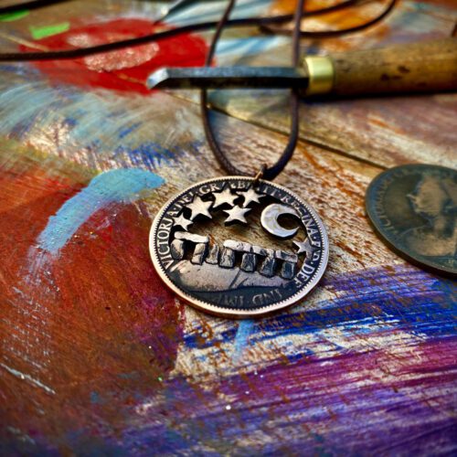 handmade and upcycled summer solstice Stonehenge coin necklace pendant