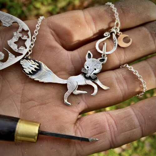 Handcrafted and recycled silver curious fox necklace made from silver coins