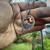 Handmade and repurposed Glastonbury Tor coin pendant necklace