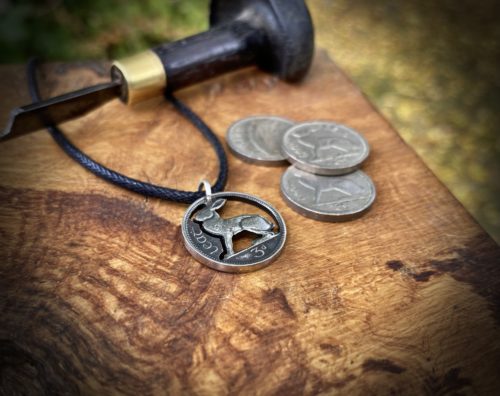 Irish hare coin jewellery. Hand-cut and carved Irish hare threepence coin pendant