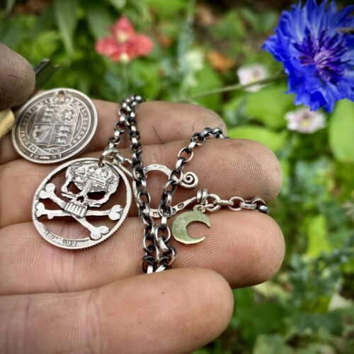 handcrafted and recycled silver shilling pirate skull and crossbones necklace