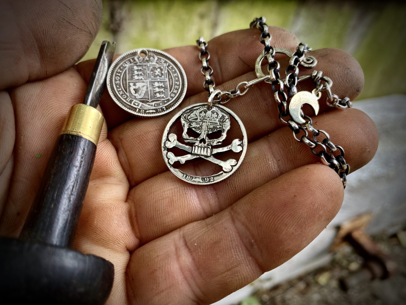 handcrafted and recycled silver shilling pirate skull and crossbones necklace