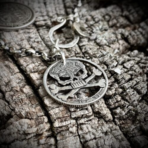 handcrafted and recycled silver shilling pirate skull and crossbones necklace