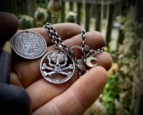 handcrafted and recycled silver shilling pirate skull and crossbones necklace