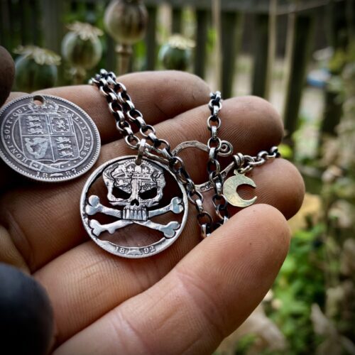handcrafted and recycled silver shilling pirate skull and crossbones necklace