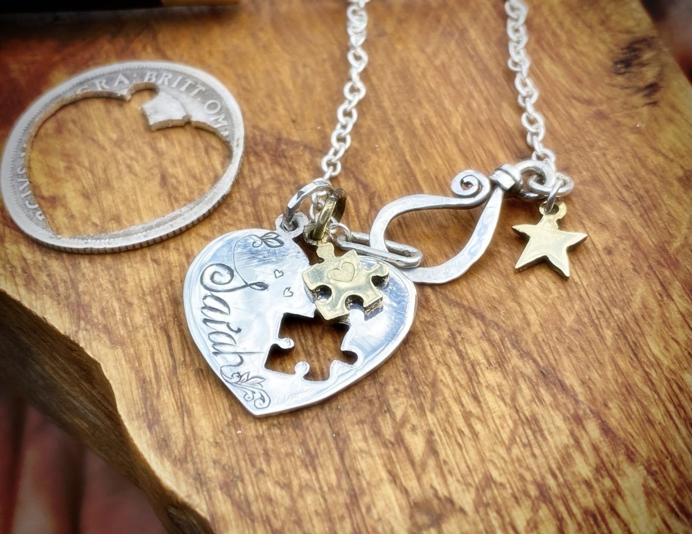 handmade and recycled silver coin love heart jigsaw necklace pendant