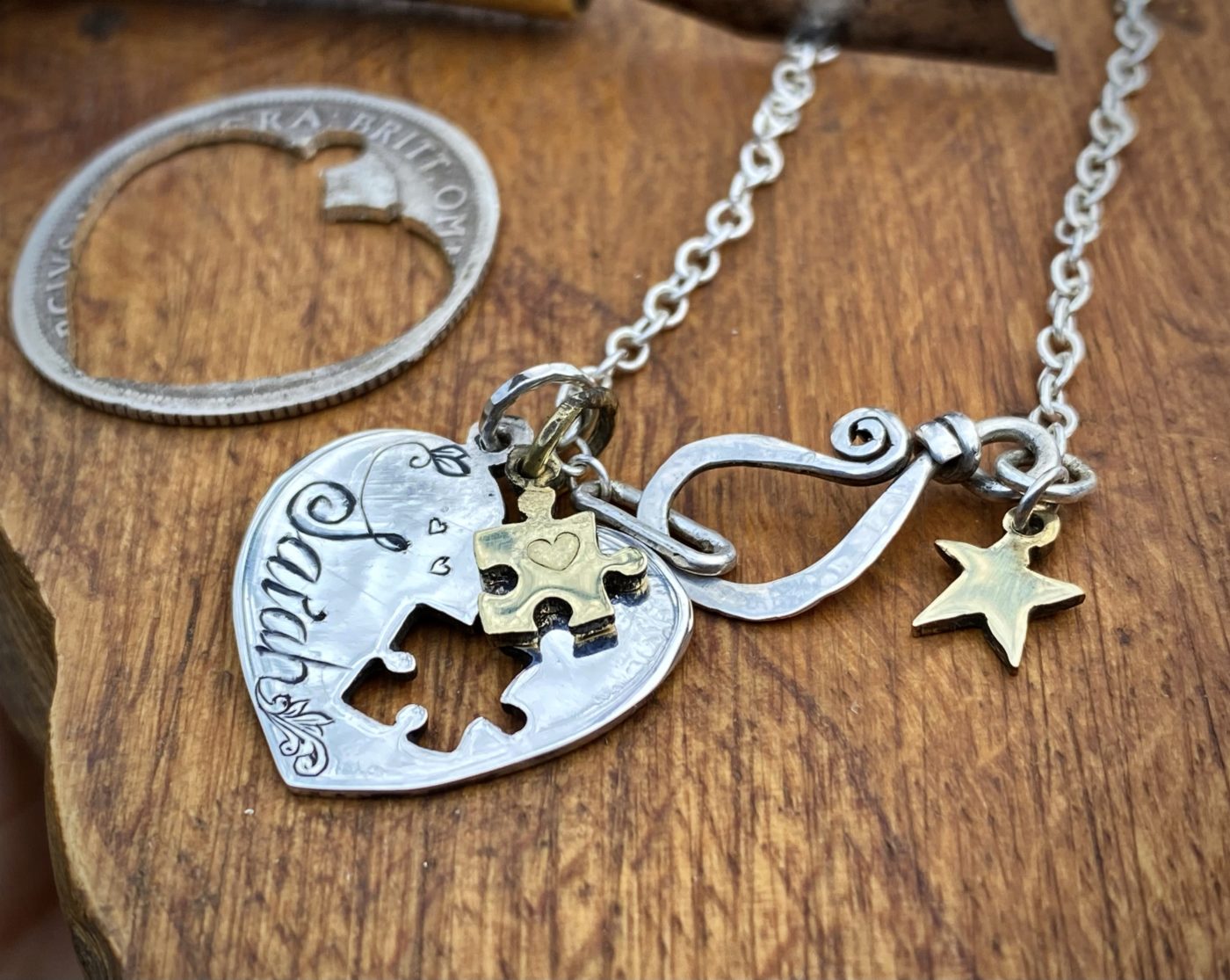 handmade and recycled silver coin love heart jigsaw necklace pendant