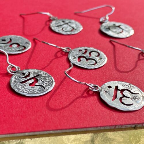 handcrafted and recycled silver threepence coin yoga earrings