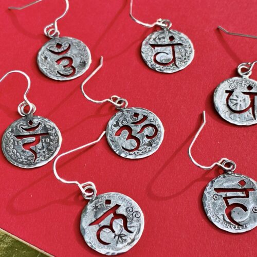 handcrafted and recycled silver threepence coin yoga earrings