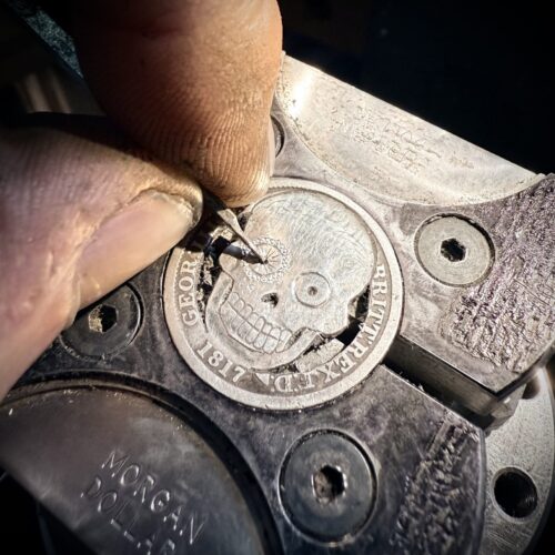Handmade and upcycled silver shilling coin day-of-the-dead skull necklace