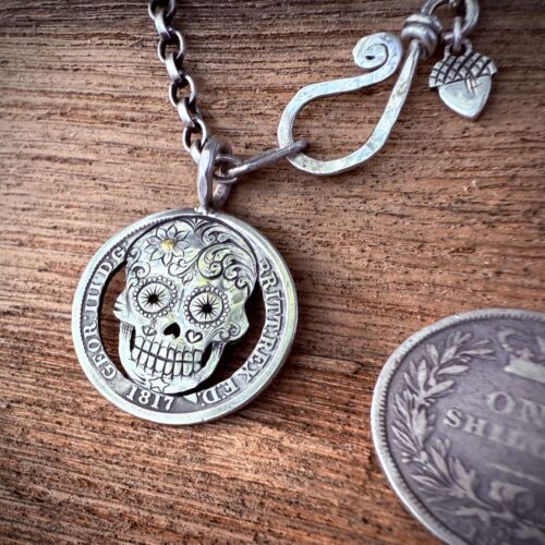 Handmade and upcycled silver shilling coin day-of-the-dead skull necklace
