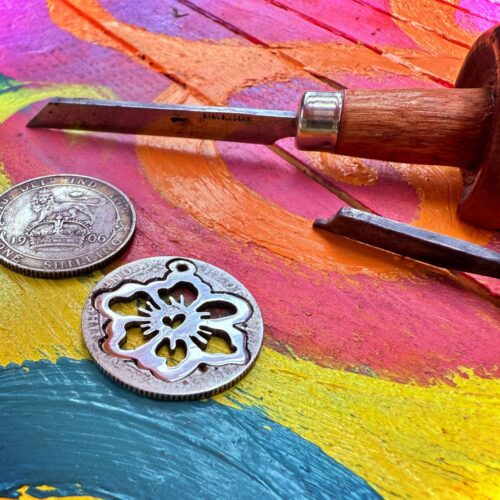 Handcrafted and recycled sterling silver shilling hawaiian flower necklace