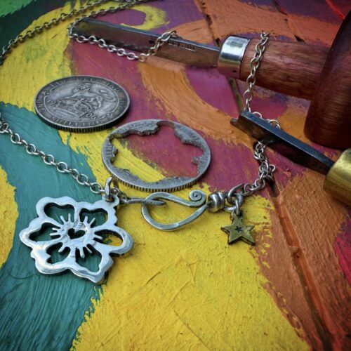 Handcrafted and recycled sterling silver shilling hawaiian flower necklace