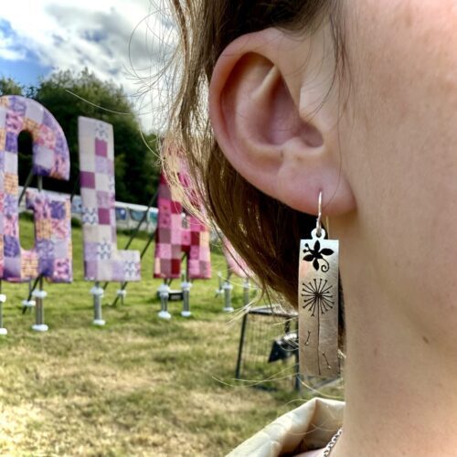 fluttering around the dandelion clock butterfly earrings made from spoons