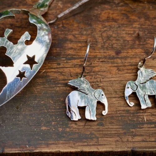Handcrafted and recycled spoon flying-elephant earrings