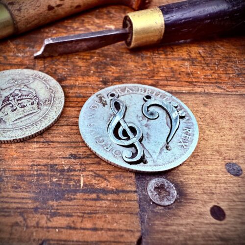 handcrafted bass and treble clef silver earrings made from upcycled silver coins