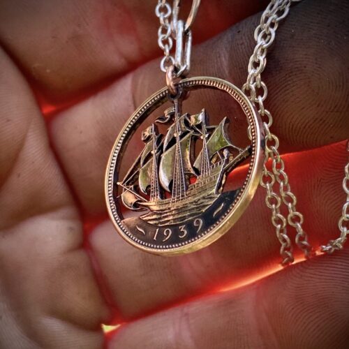 Handcrafted and repurposed Golden Hind ship coin pendant necklace