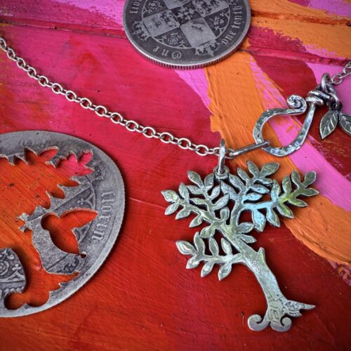 Handmade and upcycled silver spring tree made from a silver coin