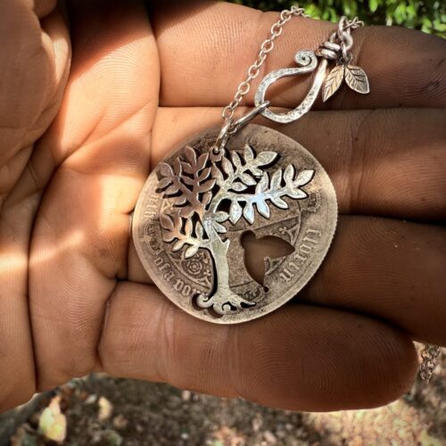 Handmade and upcycled silver spring tree made from a silver coin
