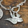 handcrafted and recycled silver coin swallow necklace pendant