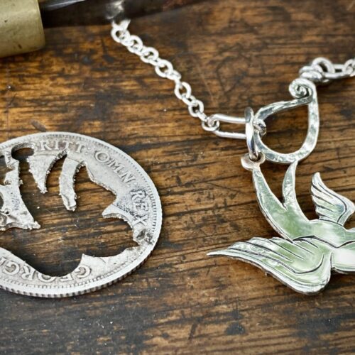 handcrafted and recycled silver coin swallow necklace pendant