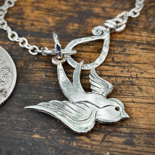 handcrafted and recycled silver coin swallow necklace pendant