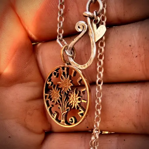 Handcrafted and up cycled edelweiss austrian shillin flower coin pendant necklace
