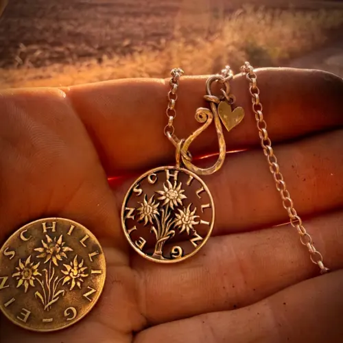 Handcrafted and up cycled edelweiss austrian shillin flower coin pendant necklace