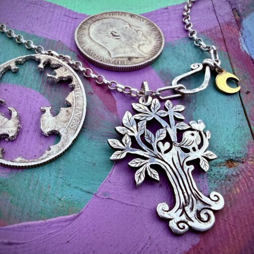 handcrafted and recycled silver coin bird and tree necklace for lovers. Utterly contemporary and original