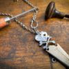 handcrafted and upcycled vintage spoon skull and crossbones necklace pendant