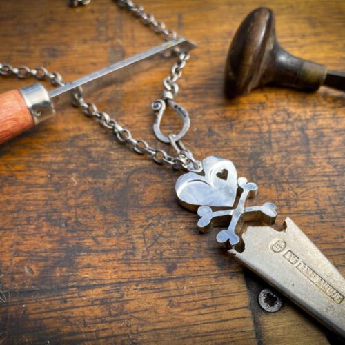 handcrafted and upcycled vintage spoon skull and crossbones necklace pendant