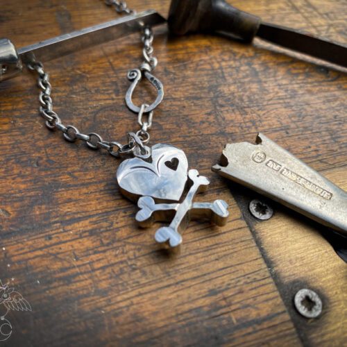 handcrafted and upcycled vintage spoon skull and crossbones necklace pendant