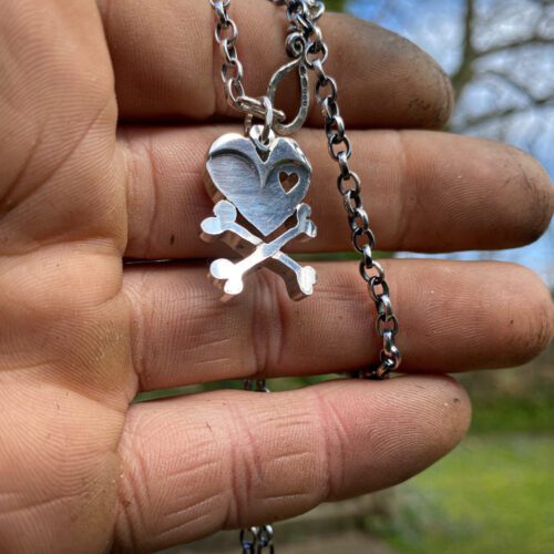 handcrafted and upcycled vintage spoon skull and crossbones necklace pendant